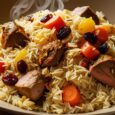 Afghan Kabuli Pulao – Aromatic rice with raisins, carrots, and meat