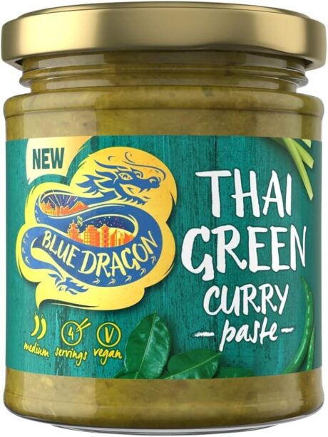 Jar of Blue Dragon Thai Green Curry Paste 170g with fresh herbs and chillies beside a steaming bowl of Thai curry—ideal for home cooking and Southeast Asian recipes.