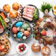 Easter hosting table with drinks snacks chocolates and multicultural foods setup